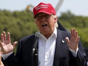 U.S. Republican presidential candidate Donald Trump speaks to the media before heading over the Iowa State Fair in Des Moines, Iowa, United States, August 15, 2015.  REUTERS/Jim Young