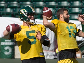 Seeing doubles. (Left to right) Jordan Lynch and Mike Reilly takes part in an Edmonton Eskimos team practice at Commonwealth Stadium, in Edmonton Alta. on Monday Aug. 10, 2015. David Bloom/Edmonton Sun/Postmedia Network