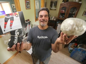 Jeff Bousquet shows off his HS Sokstraps, for which he has a patent pending. They are used on hockey socks instead of sock tape, which ends up all over a dressing room floor and eventually in landfills. (Winnipeg Sun)