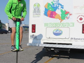 Quebec teacher Steve O'Brien demonstrates his pogo stick skills after arriving on Saturday August 15, 2015 in Sarnia, Ont. A former international track athlete, O'Brien is in the midst of a cross-country tour where he's travelling by 12 different methods -- pogo stick, scooter and wheelchair, to name a few -- to raise awareness about his children's foundation. Barbara Simpson/Sarnia Observer/Postmedia Network