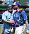 Former  Toronto Blue Jay George Bell has a word with Jose Bautista before the game against the New York Yankees in Toronto, Ont. on Sunday August 16, 2015. Craig Robertson/Toronto Sun/Postmedia Network