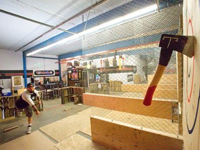Matt Thomas says axe throwing is stress-relieving and ?cheaper than therapy.? (DEREK RUTTAN, The London Free Press)