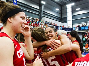 Canadian players celebrate their victory over Cuba during the 2015 FIBA Americas Women's Championship Final between Canada and Cuba at the Saville Community Sports Centre in Edmonton, Alta. on Sunday, Aug. 16, 2015. Canada won 82-66. Codie McLachlan/Edmonton Sun/Postmedia Network