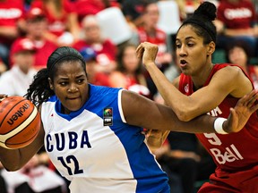 Canada`s Miranda Ayim (9) harasses Cuba`s Clenia Noblet during the 2015 FIBA Americas gold medal game Sunday (Codie McLachlan, Edmonton Sun).