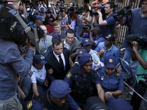 "Blade Runner" Oscar Pistorius leaves the North Gauteng High Court in Pretoria, in this file picture taken September 12, 2014. REUTERS/Mike Hutchings/Files