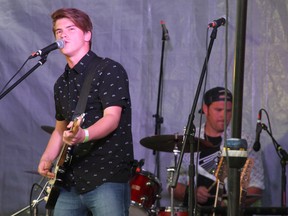 Sam Lundell, above, performs during the Come by the Hills music festival in Mistahiya. Lundell, who grew up in Lloydminster and now lives on a ranch on Range Road 50 near Vermilion, opened up the festival with a crowd-pleasing performance on Friday night.