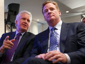 Jeff Immelt (L), Chairman and CEO of General Electric and Roger Goodell, Commissioner of the National Football League (NFL), speak together during a news conference announcing the Head Health Initiative in New York, March 11, 2013. The National Football League and General Electric Co are teaming up to improve the diagnosis and treatment of brain injuries amid growing concerns about sports-related concussions in youth and professional sports. REUTERS