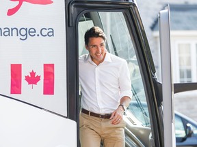 Federal Liberal Leader Justin Trudeau exits his campaign bus as he visits a home in Ajax on Monday, Aug. 17, 2015. (ERNEST DOROSZUK/Toronto Sun)