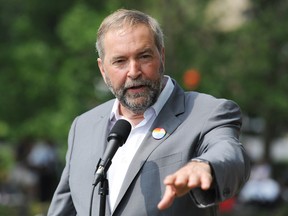 NDP leader Thomas Mulcair speaks to the media during a federal election campaign stop at the annual gay pride parade in Montreal, on Aug. 16, 2015. (THE CANADIAN PRESS/Graham Hughes)