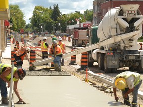 Contractors were well on their way to paving the north side of Ontario Road's sidewalk last Wednesday, Aug. 12. The entirety of the north side Streetscape construction, except the final coat of asphalt on the street, should be completed by Aug. 24. GALEN SIMMONS/MITCHELL ADVOCATE