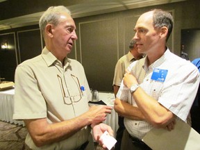 Don Woods, left, with the Bowman Centre, speaks with Andre Reif on Monday August 17, 2015 in Point Edward, Ont., following Woods' presentation at the Rotary Club of Sarnia about the centre's ongoing work to encourage the building of a new refinery in Sarnia-Lambton. (Paul Morden/Sarnia Observer/Postmedia Network)