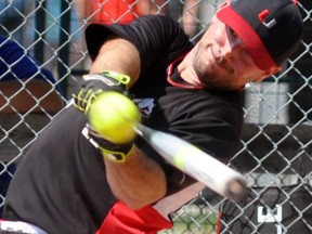 Jeff Van Nynatten of the Underdogs, the ‘A’ champs of the 34-team men’s division, connects with a pitch during action from the 38th annual Mitchell Grizzlies slo-pitch tournament Sunday. ANDY BADER/MITCHELL ADVOCATE