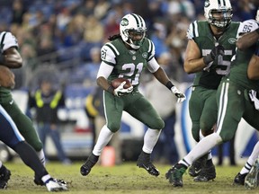 Chris Johnson of the New York Jets looks for a hole to run the ball during a game against the Tennessee Titans at LP Field on December 14, 2014. (Wesley Hitt/Getty Images/AFP)
