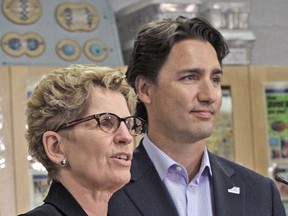 Federal Leader Justin Trudeau and Ontario Premier Kathleen Wynne are seen in this 2014 file photo. Wynne has put her full support behind Trudeau and his federal campaign, but our panel asks if she's been helpful or harmful. Mike DiBattista/Niagara Falls Review/Postmedia Network/File