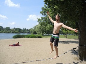 Teddy Brescacin practices rope walking at Mooney's Bay Park on a stifling day in the city on Monday, Aug. 17, 2015 where the temperature soared to 39C with the humidex.
JULIE BAY/Ottawa Sun