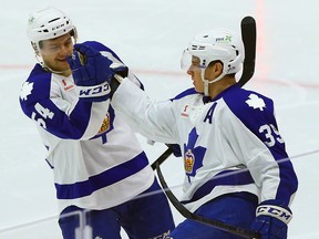 Matt Frattin (right) will be trying to work his way up from the Marlies to the Leafs, where he played just nine games last season and recorded no points. (Dave Abel/Toronto Sun)