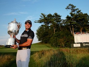 Australian Jason Day poses with the Wanamaker trophy after winning the PGA Championship at Whistling Straits on Sunday. It was Day’s first major victory. (Getty Images/AFP)