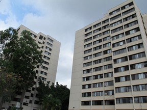 The Hale Wainani dormitory is seen at the University of Hawaii in Honolulu on Monday, Aug. 17, 2015. Two men fell from the 14th floor of the University of Hawaii dormitory, one of them to his death while trying to pull the other from a ledge, Honolulu police said. The 24-year-old man who died was trying to bring inside an apparently distraught 19-year-old who went out a window onto the ledge early Sunday, authorities said. (AP Photo/Jennifer Sinco Kelleher)
