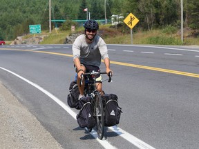 Corey Alexander, of Port Burwell, Ont., is cycling across Canada to raise money and awareness for brain tumor research after his 11-year-old cousin passed away from a brain tumor. Alexander travelled through Sudbury, Ont. on Monday, August 17, 2015. John Lappa/Sudbury Star/Postmedia Network