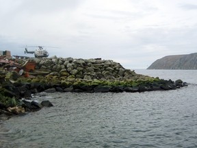 This Aug. 30, 2011, file photo provided by the U.S. Army Corps of Engineers shows Big Diomede Island in Russia, right background, as seen from Little Diomede Island in the U.S. state of Alaska, left foreground. (George A. Kalli/U.S. Army Corps of Engineers via AP, File)