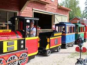Lucas Obonsawim, train engineer,  took the young and the young at heart on a tour in the Polar Bear Habitat and Heritage Village during the annual Heritage Day on Sunday.