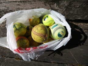 This photo taken July 30, 2015, shows a sack full of softballs. (Danielle Peterson/Statesman-Journal via AP)
