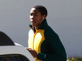 Former South African President Nelson Mandela's grandson Mbuso is seen jogging outside his grandfather's house. (REUTERS/Siphiwe Sibeko)