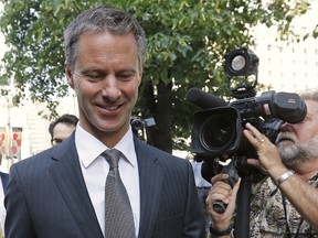Nigel Wright, former chief of staff to Canadian Prime Minister Stephen Harper, arrives at the courthouse in Ottawa, August 18, 2015. Wright is testifying in the trial of suspended Senator Mike Duffy, who is accused of receiving a bribe and abusing expense claims. (REUTERS/Chris Wattie)