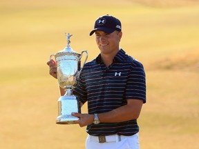 Jordan Spieth poses with the trophy after winning the 115th U.S. Open Championship at Chambers Bay in University Place, Wash., on Sunday, June 21, 2015. (David Cannon/Getty Images/AFP)