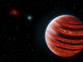 An artist's impression shows the newly found planet 51 Eridani b, which was discovered about 100 light years from Earth by a team headed by former Kingston resident and Stanford University physics professor Bruce Macintosh.
Handout image courtesy Los Alamos National Laboratory