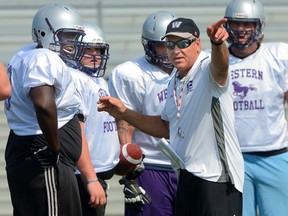 Western Mustang head coach Greg Marshall talks to some players during workouts at TD Waterhouse stadium on Monday. (MORRIS LAMONT, The London Free Press)