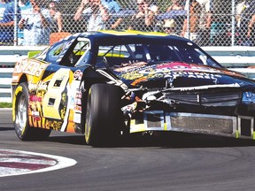 Don Thomson Jr. drives with a bit of a hood problem during a race in 2011. (SUN FILES)