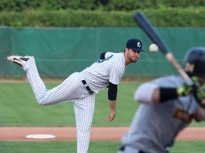 London Majors pitcher Adam Paish delivers to Kitchener Panthers? Tanner Nivins during Game 4 of their best-of-seven Intercounty Baseball League semifinal series at Labatt Park on Tuesday. The Panthers won 8-6 to tie the series 2-2.  (CRAIG GLOVER, The London Free Press)