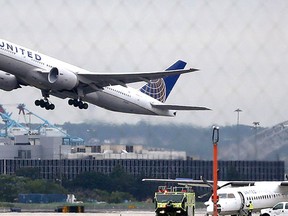 Departing United Airlines plane.  (AP Photo/Julio Cortez)