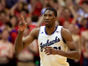 Joel Embiid of the Kansas Jayhawks reacts after scoring during the game against the Oklahoma State Cowboys at Allen Fieldhouse on January 18, 2014. (Jamie Squire/Getty Images/AFP)