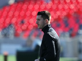 Ottawa Fury FC midfielder Phil Davies rides the stationary bike at TD Place while watching practice earlier this summer. Davies suffered a badly broken arm during a pre-season game. Chris Hofley/Ottawa Sun files