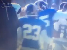 Dallas Cowboys receiver Dez Bryant gets punched in the face on Tuesday during an on-field brawl between the Cowboys and St. Louis Rams. (Screen grab)