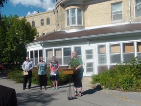 (From right) Family Services Minister Kerri Irvin-Ross, Minister of Child and Youth Opportunities Melanie Wight, Blue Thunderbird Family Care founder Josie Hill and Marymound CEO Jay Rodgers stand in front of Marymound Aug. 19, 2015 to announce the opening of a new youth stabilization unit.