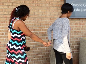 Alicia Jasquith (left), mother of Lecent Amos-Ross, leaves court on Wednesday Aug. 18, 2015 after the co-accused charged in her daughter's death made a court appearance. (Nick Westoll/Toronto Sun)