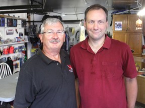 Dan Haslip, left, and his son Christopher stand in their Explorer Diving dive shop in Kingston, Ont. on Wednesday, Aug. 19, 2015. They are sponsoring a dive day later this month where people can try out scuba diving by making a donation to the humane society. Michael Lea/The Whig-Standard/Postmedia Network