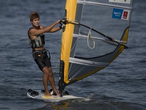 South Korean Wonwoo Cho sails inshore after competing in the men’s RS:X Windsurfer sailing test event, in Guanabara Bay, Rio de Janeiro, Brazil, Wednesday, Aug. 19, 2015. (AP Photo/Leo Correa)