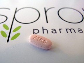 FILE - In this June 22, 2015, photo, a tablet of flibanserin sits on a brochure for Sprout Pharmaceuticals in the company's Raleigh, N.C., headquarters. The Food and Drug Administration on Tuesday, Aug. 18, 2015, approved the first prescription drug designed to boost sexual desire in women, a milestone long sought by a pharmaceutical industry eager to replicate the blockbuster success of impotence drugs for men. (AP Photo/Allen G. Breed)