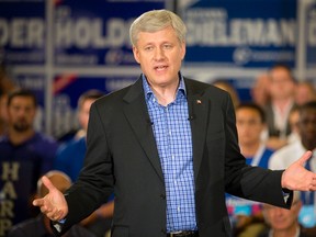 Prime Minister Stephen Harper addresses supporters during a rally at the Best Western Lamplighter Inn in London on Wednesday. (CRAIG GLOVER, The London Free Press)