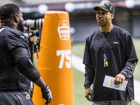 Hamilton Tiger Cats defensive coordinator Orlondo Steinauer (right) during the team's practice at the CFL's 102nd Grey Cup Festival in Vancouver, B.C. on Wednesday November 26, 2014. The Hamilton Tiger Cats will play the Calgary Stampeders for the Canadian football league championship title on Sunday, November 30.  Carmine Marinelli/QMI Agency