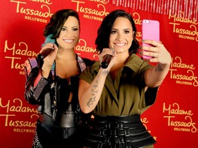 Demi Lovato receives the ultimate 23rd birthday gift from Madame Tussauds Hollywood: her own wax figure on August 17, 2015 in Hollywood, California.  Rachel Murray/Getty Images for Madame Tussauds Hollywood/AFP