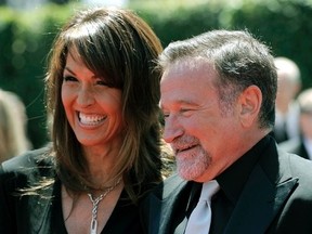 In this Saturday, Aug. 21, 2010, Robin Williams, right, and Susan Schneider arrive at the Creative Arts Emmy Awards in Los Angeles. Robin Williams' children say the late actor's wife is trying to increase her share of his estate at their expense. In the latest court filing, on Aug.14, 2015 the ongoing battle over Williams' estate, Zachary, Zelda and Cody Williams are asking a judge to dismiss a petition filed by Susan Schneider Williams. (AP Photo/Chris Pizzello, File)