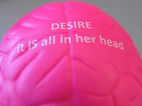In this June 22, 2015, photo, a brain-shaped stress ball sits on a worker's desk at Sprout Pharmaceuticals' Raleigh, N.C., headquarters. (AP Photo/Allen G. Breed)