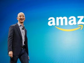 In this June 16, 2014, file photo, Amazon CEO Jeff Bezos walks onstage for the launch of the new Amazon Fire Phone, in Seattle. A New York Times article portrayed Amazon’s work culture as “bruising” and “Darwinian” in part because of the way it uses data to manage its staff. Amazon’s CEO said in a memo to staff on Monday, Aug. 17, 2015, that the article doesn’t accurately describe the company culture he knows. (AP Photo/Ted S. Warren, File)