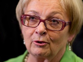 Lac Megantic Mayor Colette Roy-Laroche speaks with the media about rail safety measures announced by the government on Wednesday, April 23, 2014 in Ottawa. Roy-Laroche has announced her retirement from municipal politics. THE CANADIAN PRESS/Adrian Wyld