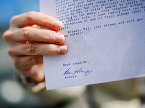 Victoria (pseudonym), in her mid-20s, shows a letter sent to her and signed by Anders Breivik on July 31, 2015, in Stockholm. Victoria claims Anders Behring Breivik is her best friend. (AFP PHOTO/JONATHAN NACKSTRAND)